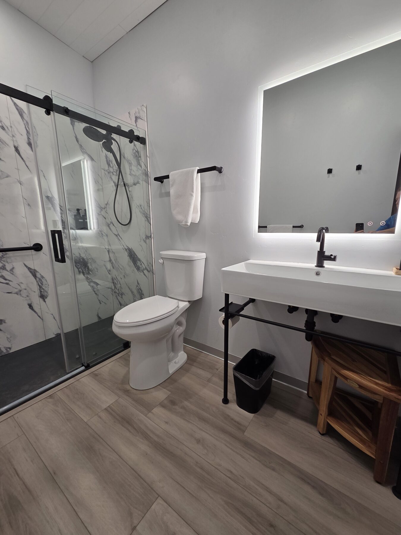 B&B suite bathroom with marble shower and LED mirror
