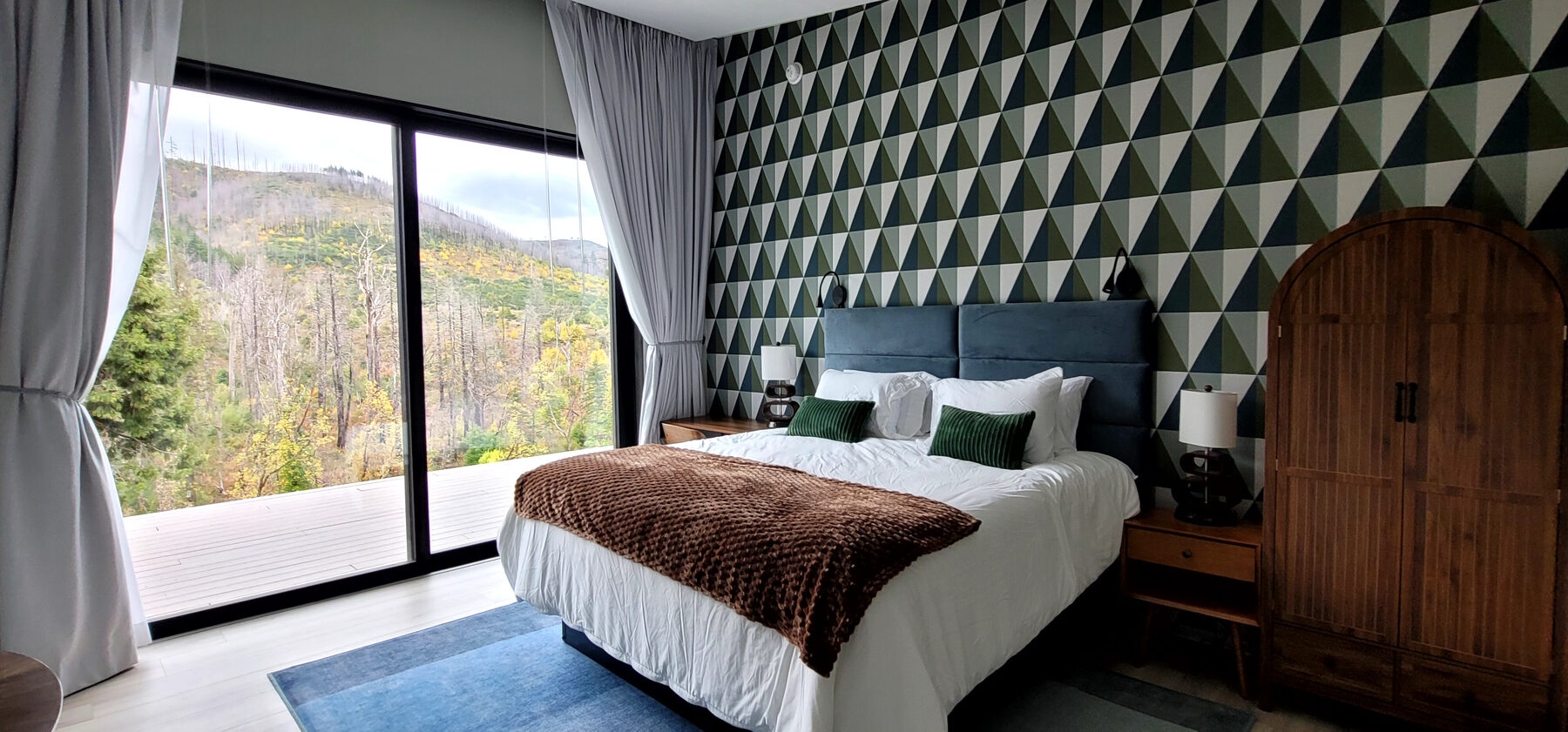 Geometric accent suite with autumn river view