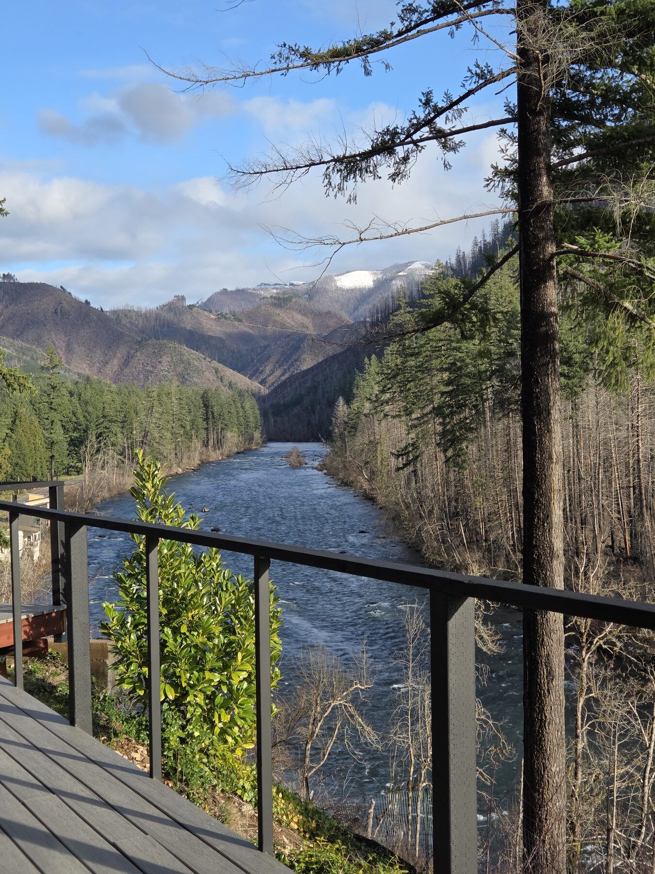The McKenzie River framed by a deck railing