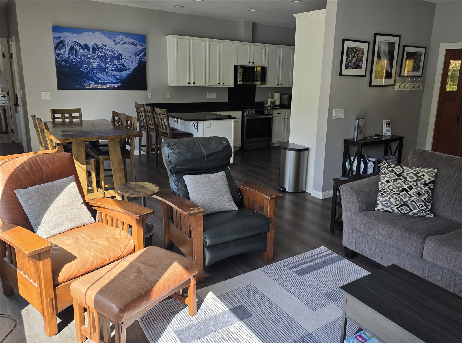 Open living room, dining table and kitchen at The River Front House